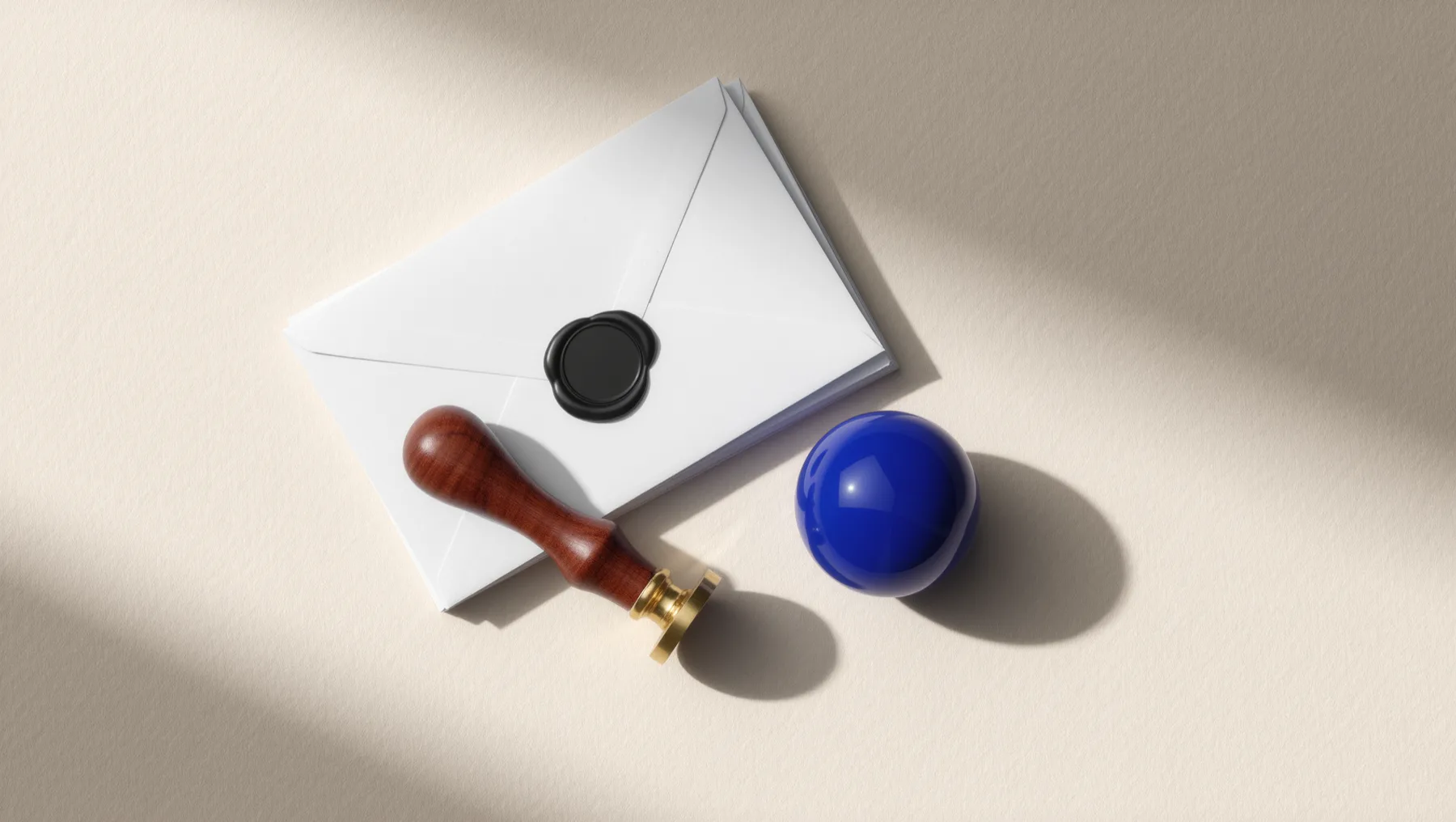 Envelope with a black wax seal and a seal stamp, a cobalt-blue sphere beside them