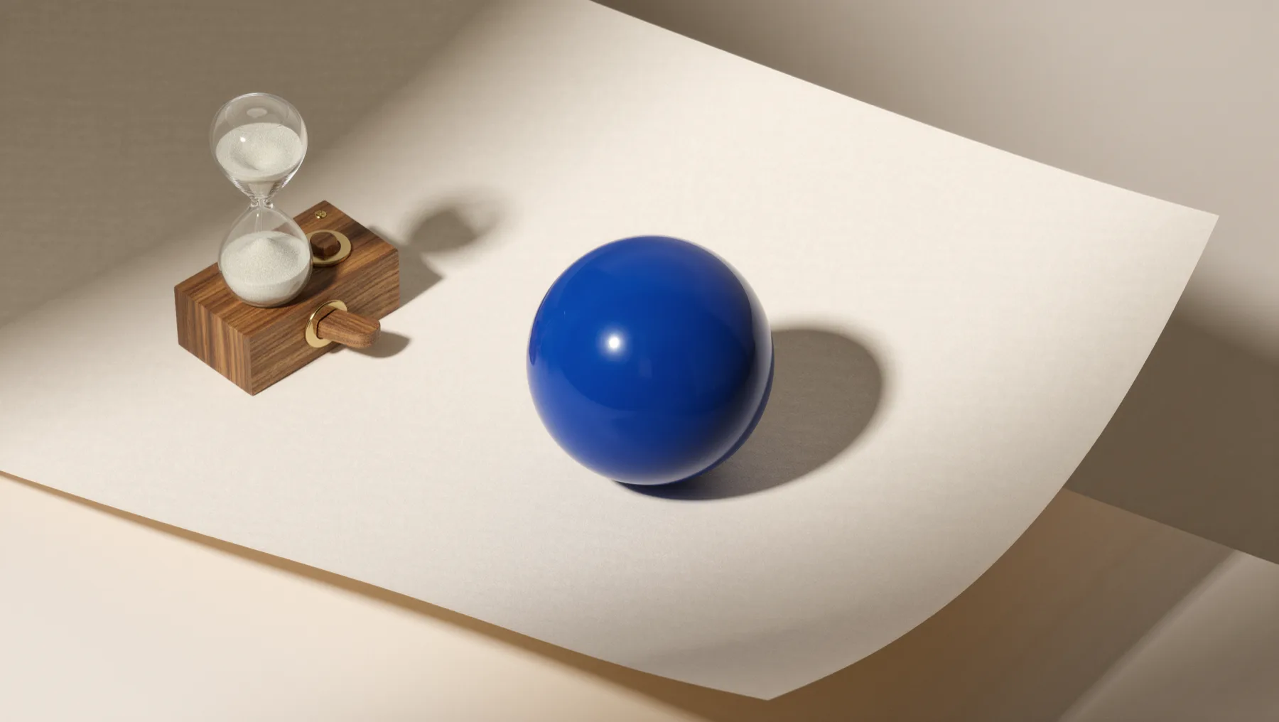 Hourglass and toggle switch on a wooden block, a cobalt-blue sphere beside them
